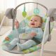 Happy infant enjoying toys in Bright Starts 6-Speed Portable Baby Swing