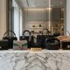 Collection of top luxury handbags from leading designer labels displayed on a marble surface in 2026