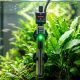 Modern fish tank in a sunny Florida room with a digital water thermometer.