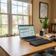 Person working at a clean desk in an Ohio office using an affordable ergonomic mouse.